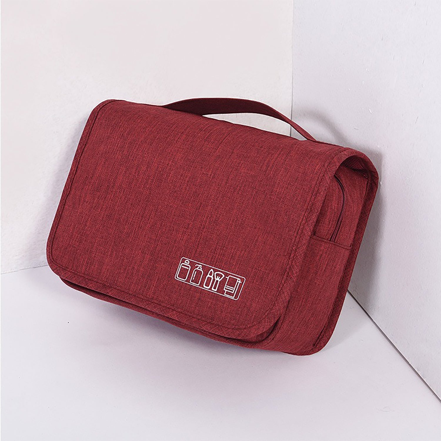 Red toiletry bag with icons on a white background