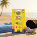 Banana Boat Kids Sport sunscreen packaging on a beach with towel and sandal in the background