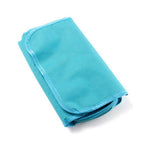 Folded blue toiletry bag on a white background