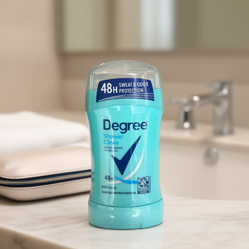 Degree Shower Clean deodorant stick on a bathroom counter with a blurred background