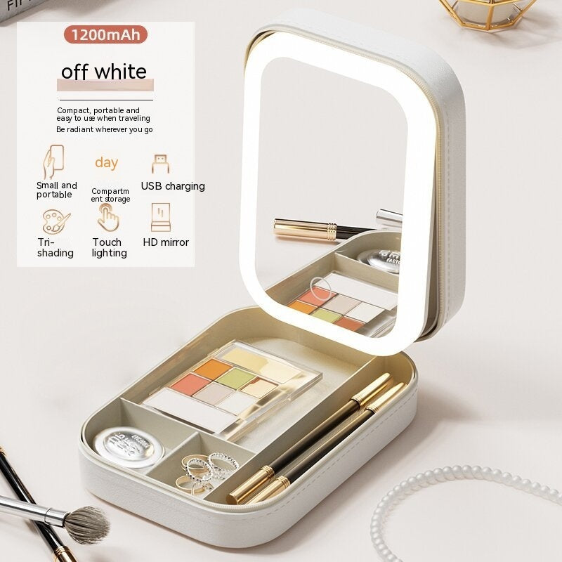 Makeup set with a light-up mirror in a white case on a light background