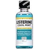 Travel-sized bottle of Listerine Cool Mint mouthwash on a white background