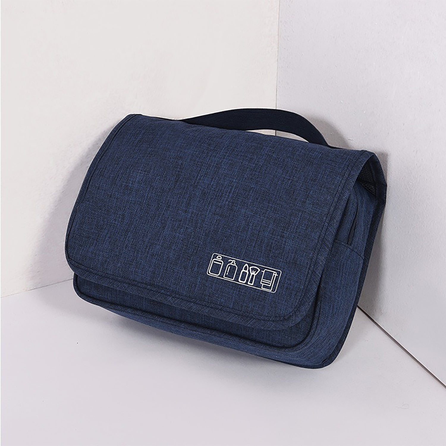 Dark blue toiletry bag with icon on a white background