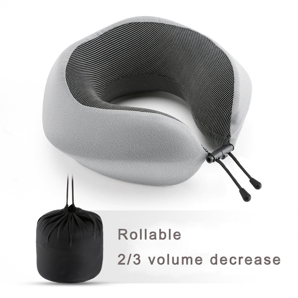 Gray travel neck pillow with a black carrying pouch on a white background