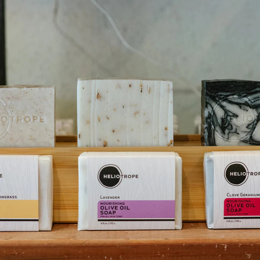 Assorted Heliotrope organic olive oil soaps on display.