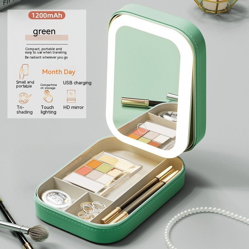 Green makeup case with mirror and tools on a gray background