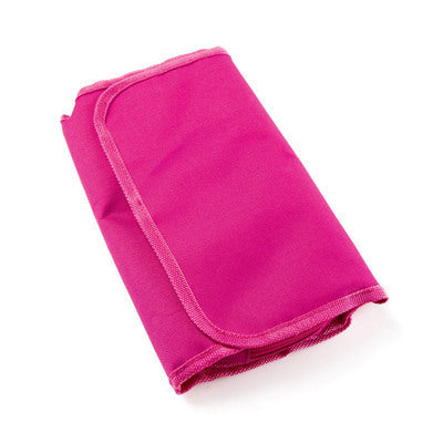 Folded pink toiletry bag on a white background