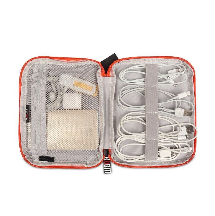 Open travel organizer with electronic accessories on a white background