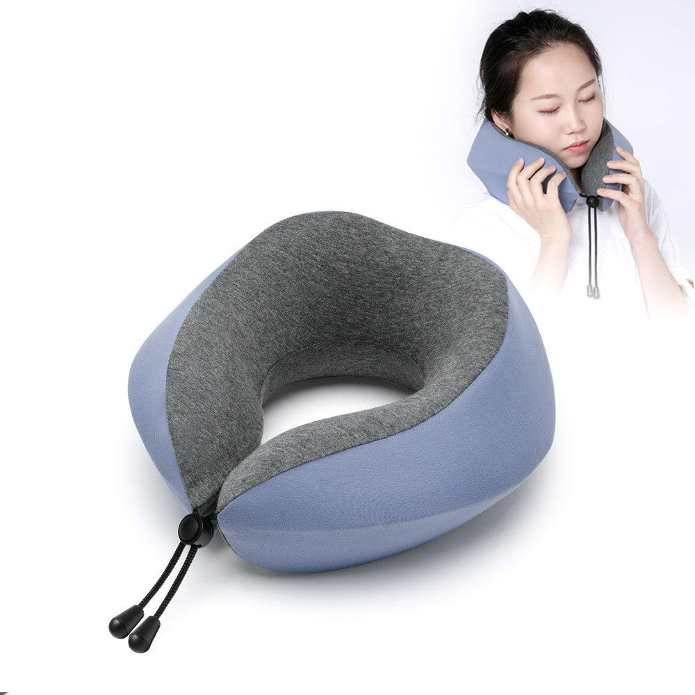 Gray and blue travel neck pillow with a person using it on a white background