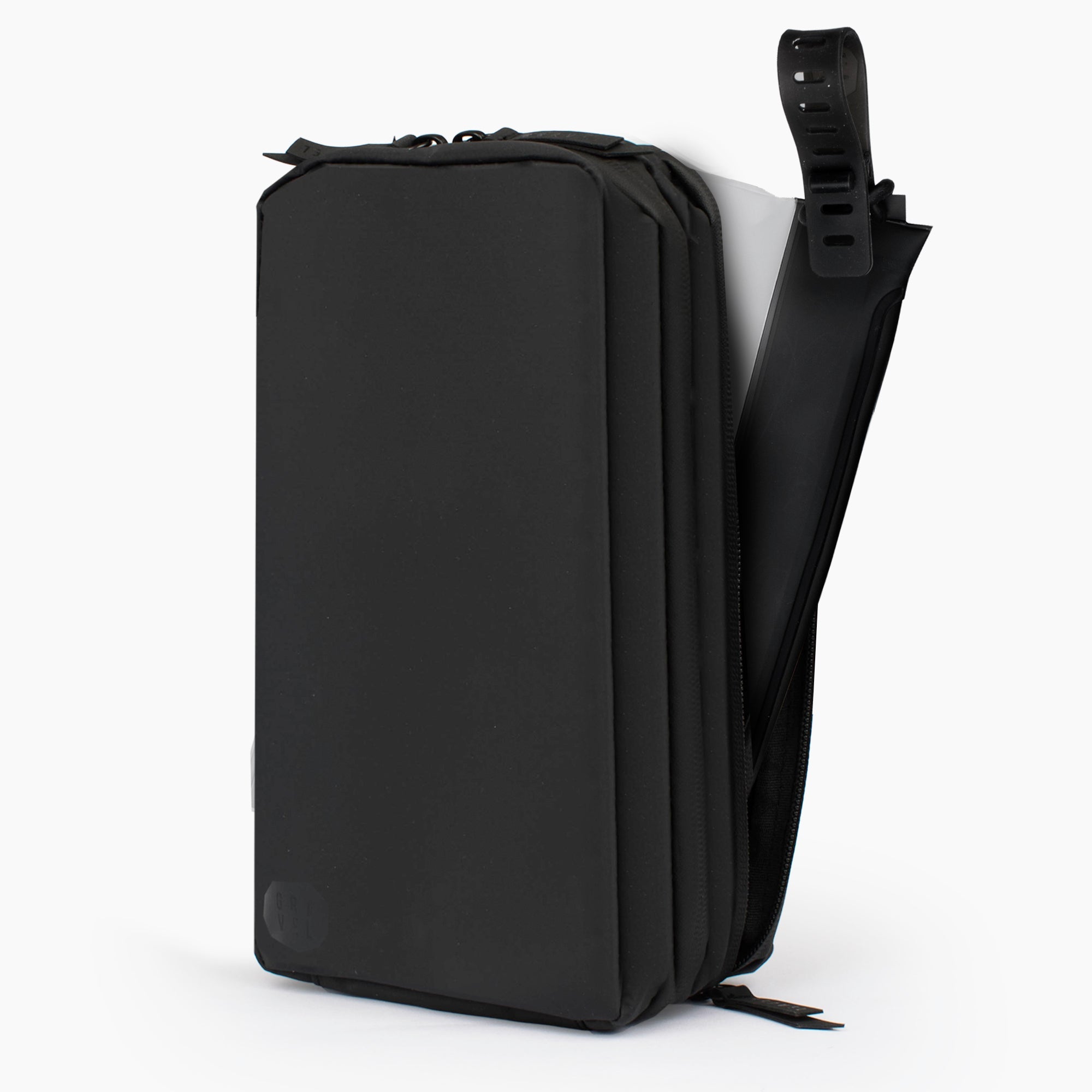 Black toiletry bag with a shoulder strap on a white background