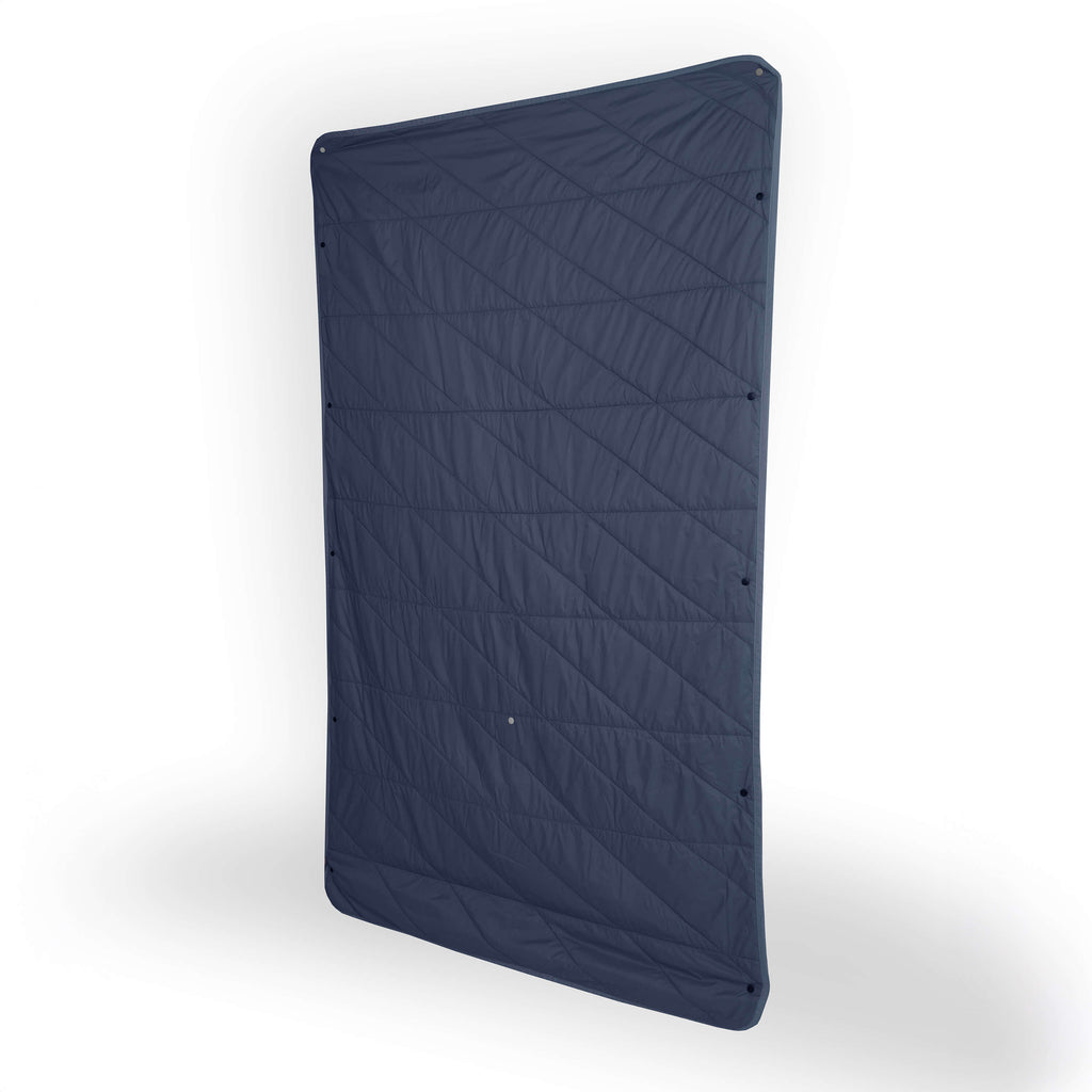 Dark blue quilted mat on a white background