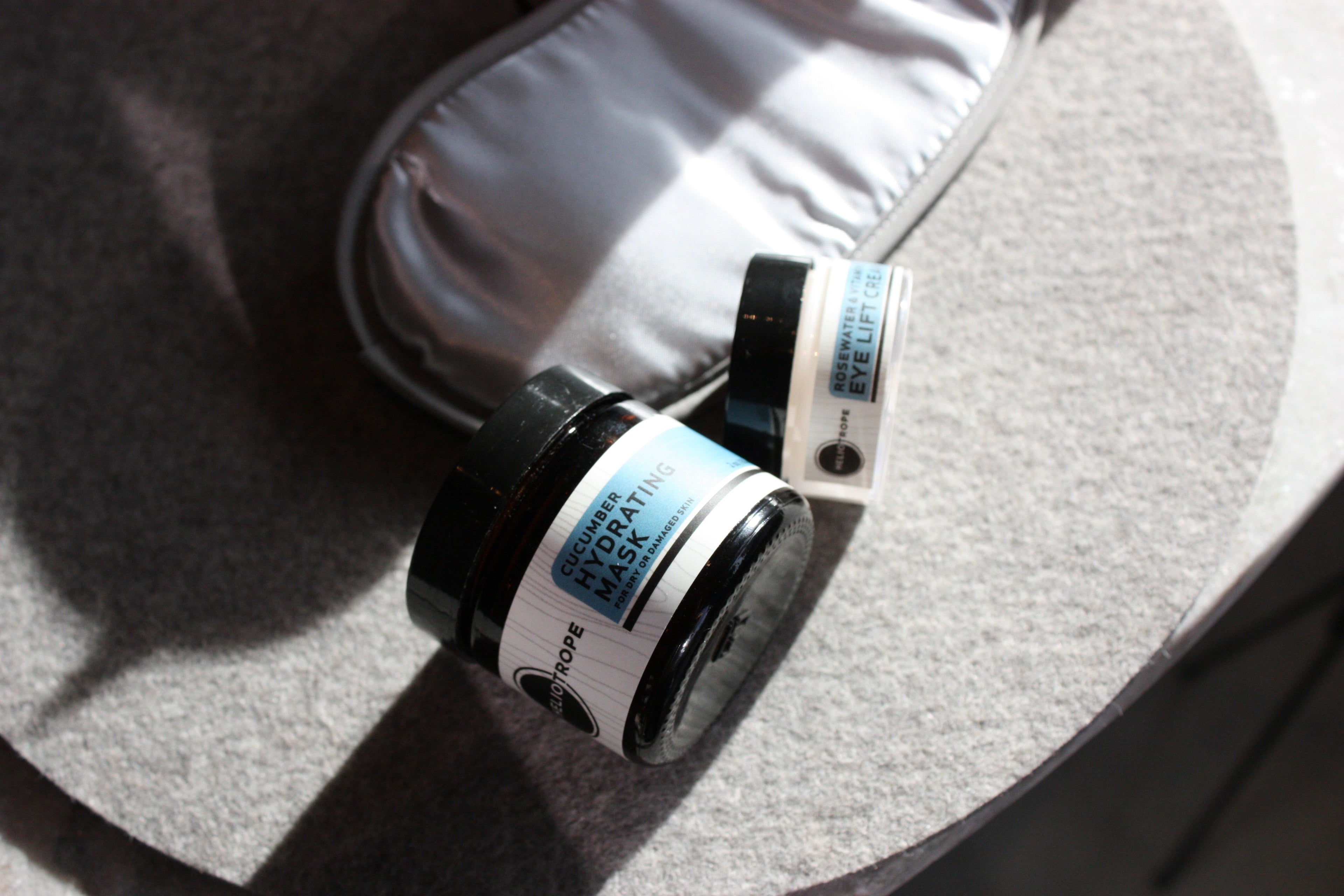 Rosewater & Vitamins Eye Lift Cream in compact travel essentials