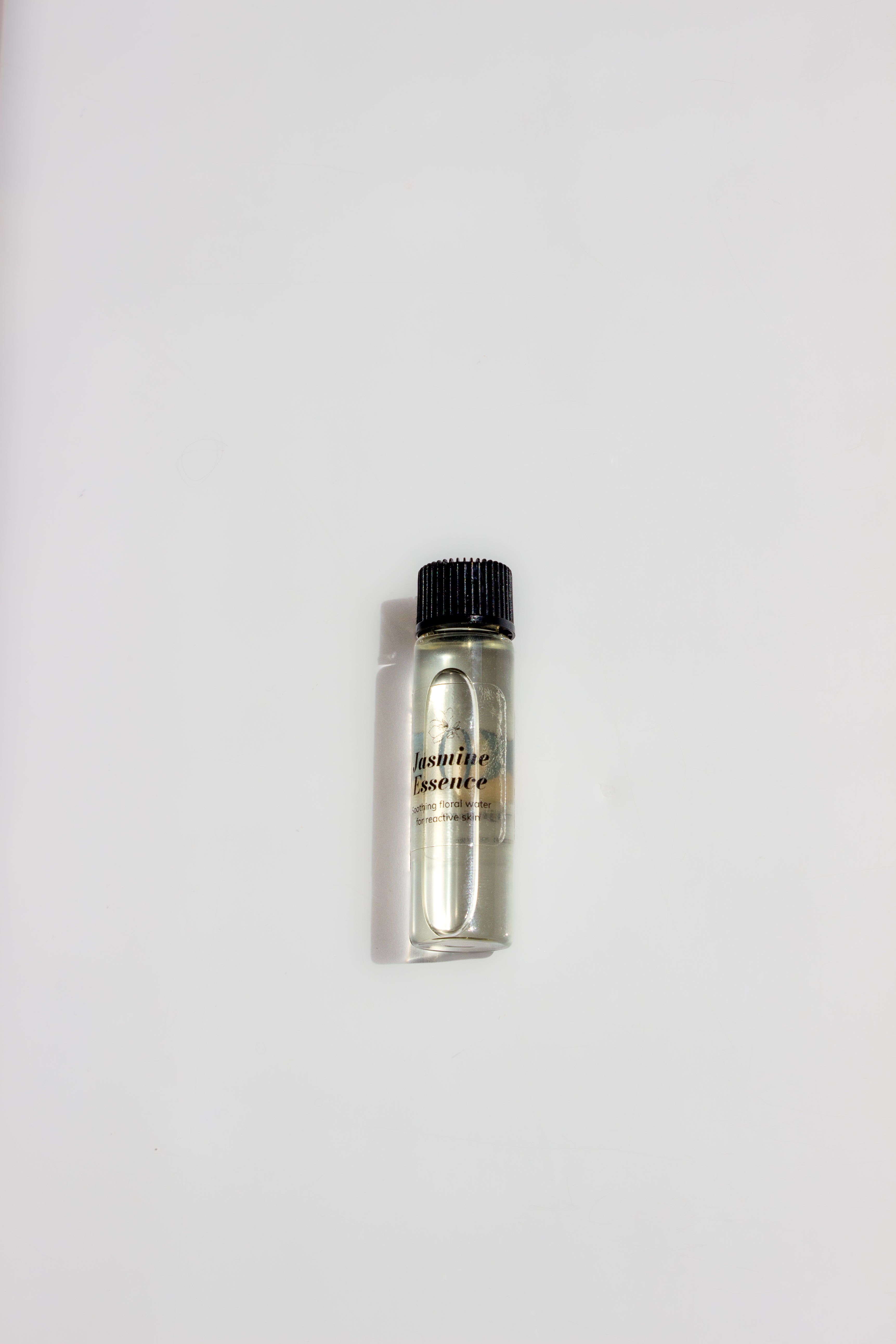 Bottle of Jasmine Essence on a white background.
