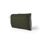 Green travel pillow on a white background