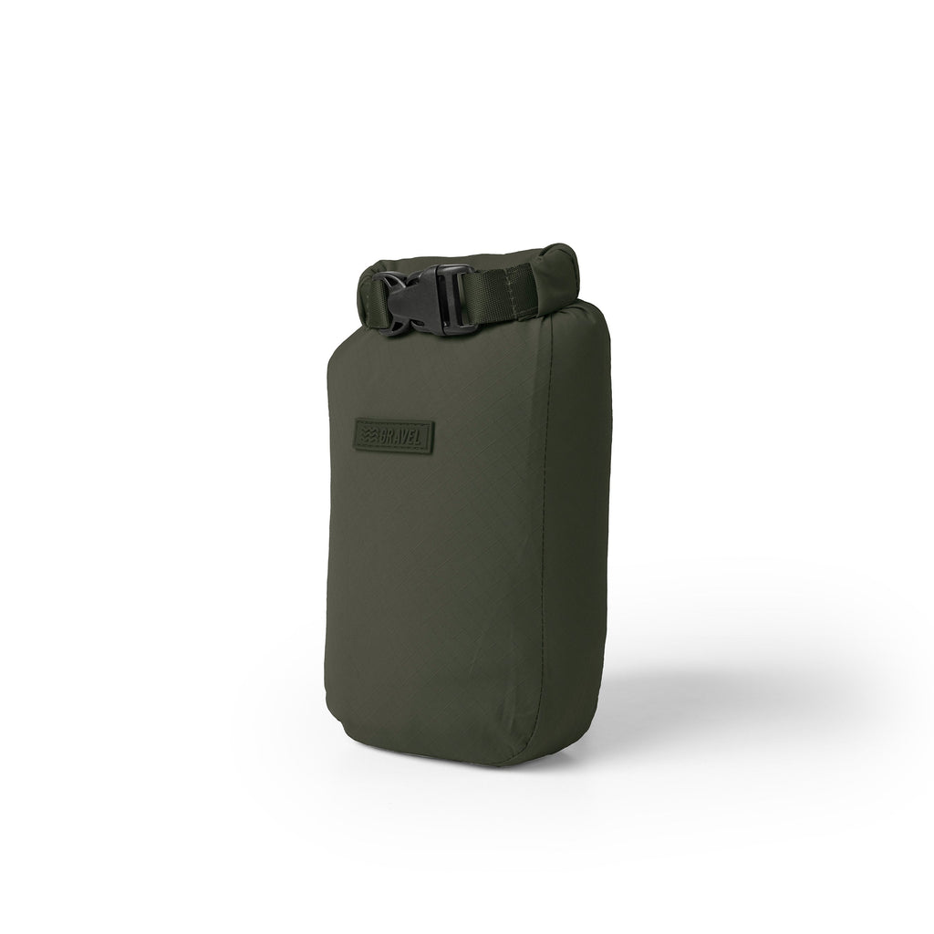 Green dry bag with a black buckle on a white background