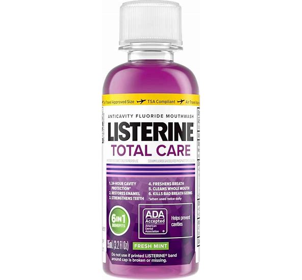 Travel-sized bottle of Listerine Total Care mouthwash on a white background