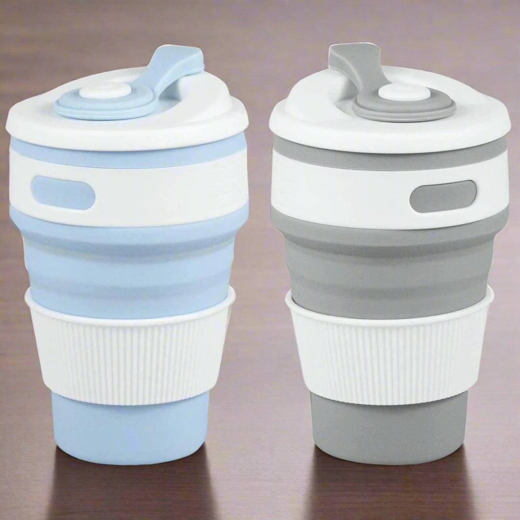 Two collapsible travel cups, one blue and white, one gray and white, on a white background.