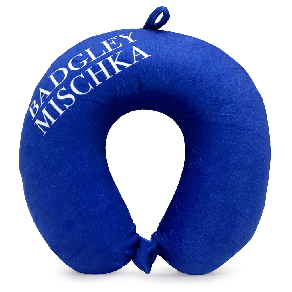 Cobalt blue neck pillow with 'Badgley Mischka' branding on a white background