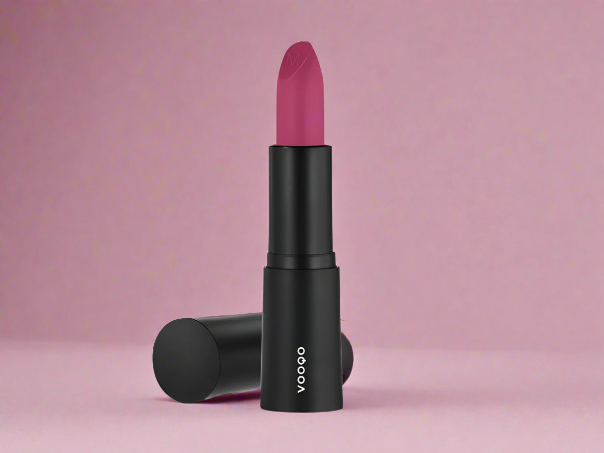 Vooqo Lipstick in Cranberry shade, shown in sleek tube with swatch of bright fuchsia satin color
