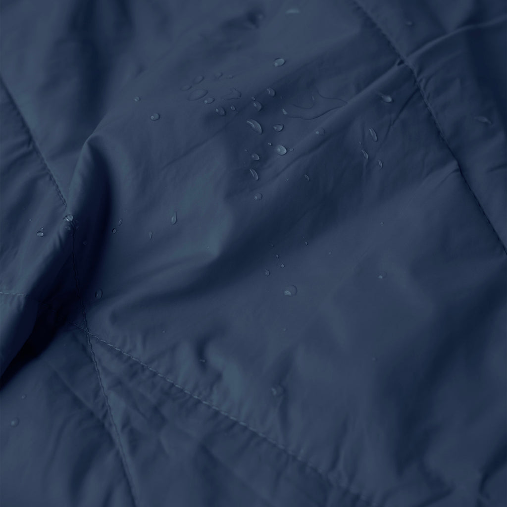 Close-up of a dark blue fabric with water droplets on it