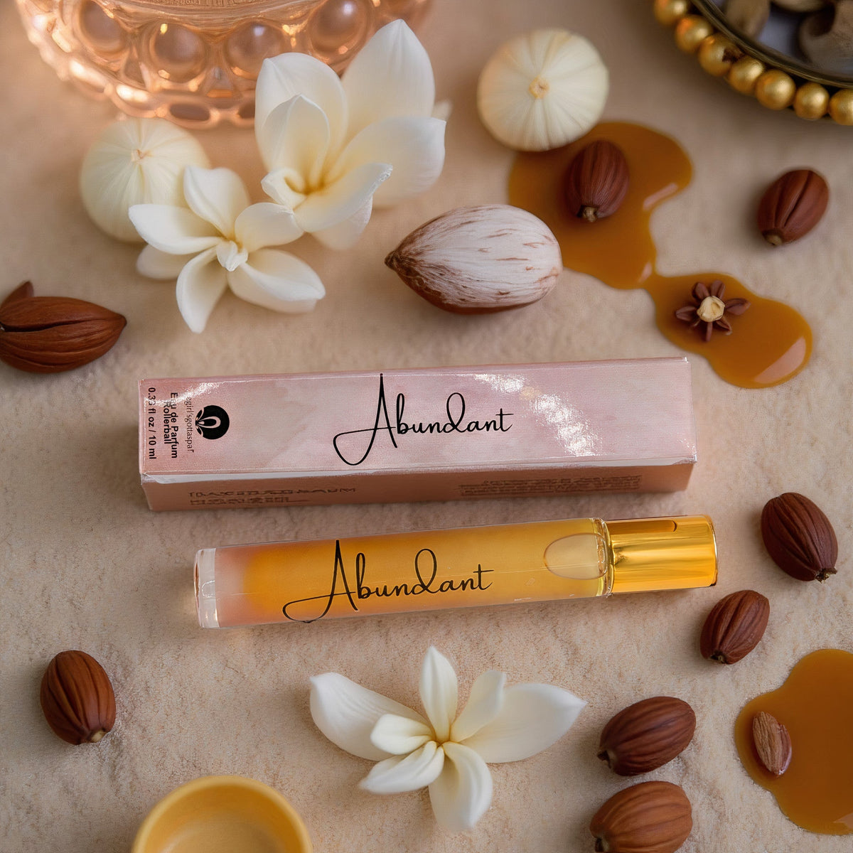 Abundant Rollerball Perfume bottle next to box