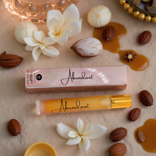 Abundant Rollerball Perfume bottle next to box