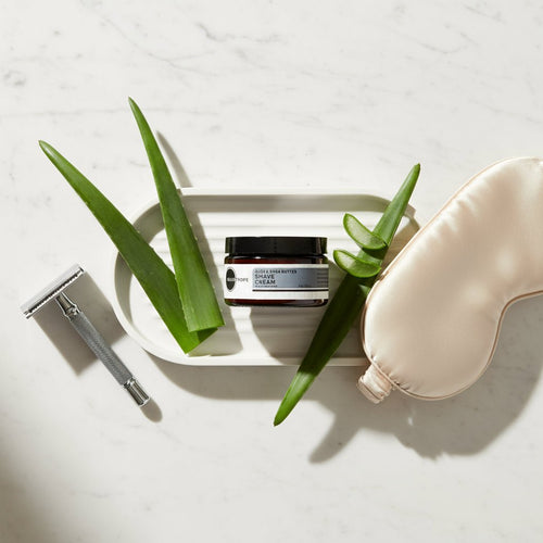 Aloe & Shea Butter Shave Cream with aloe plants and razor
