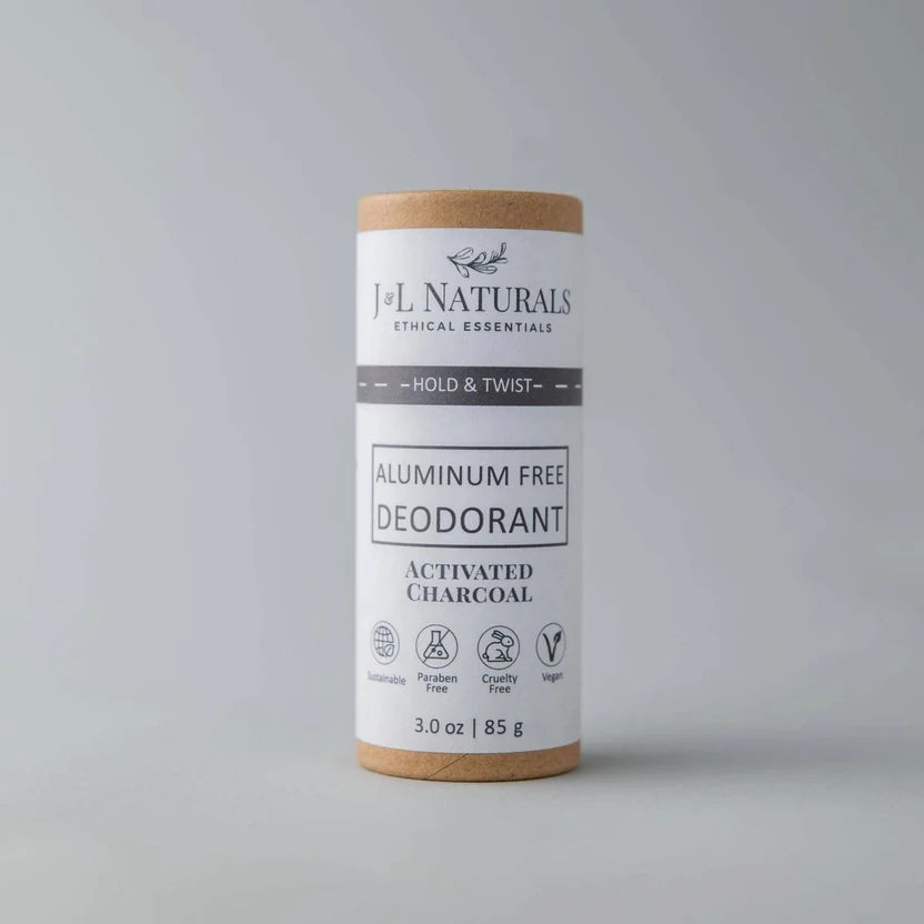 J&L Naturals aluminum-free deodorant on a gray background. It comes in paper packaging and features activated charcoal.