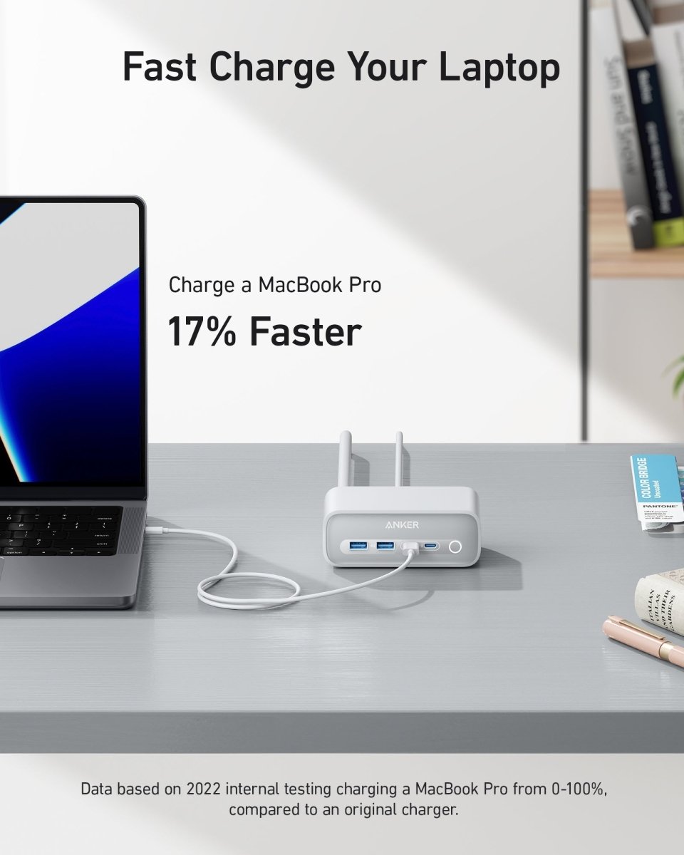 Laptop charging with a fast charging device on a desk, with text indicating faster charging speed.