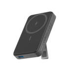 Black wireless charging pad with stand on a white background