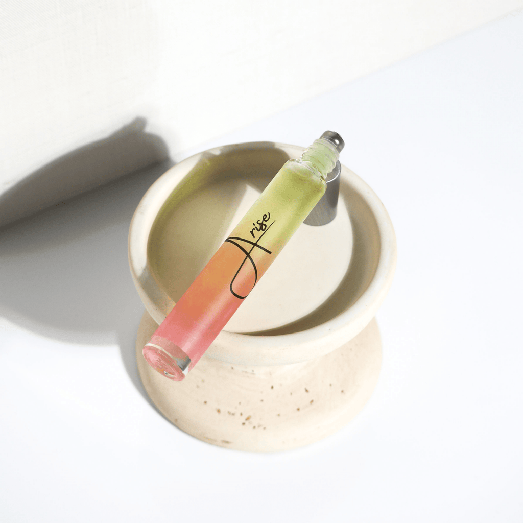 Lip gloss with a gradient color on a white surface