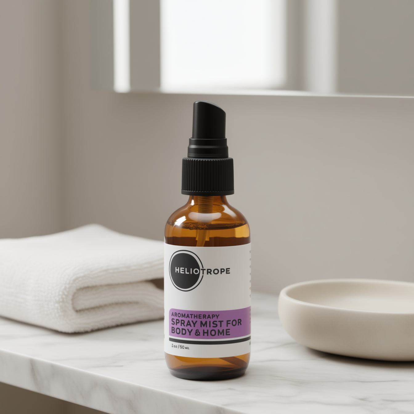 Heliotrope spray mist bottle on a marble surface with a neutral background