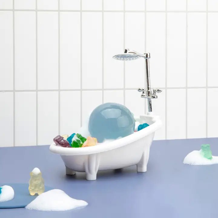 be bare Twist Ball Cleanser – Aqua Jelly Ball in a playful bath setup