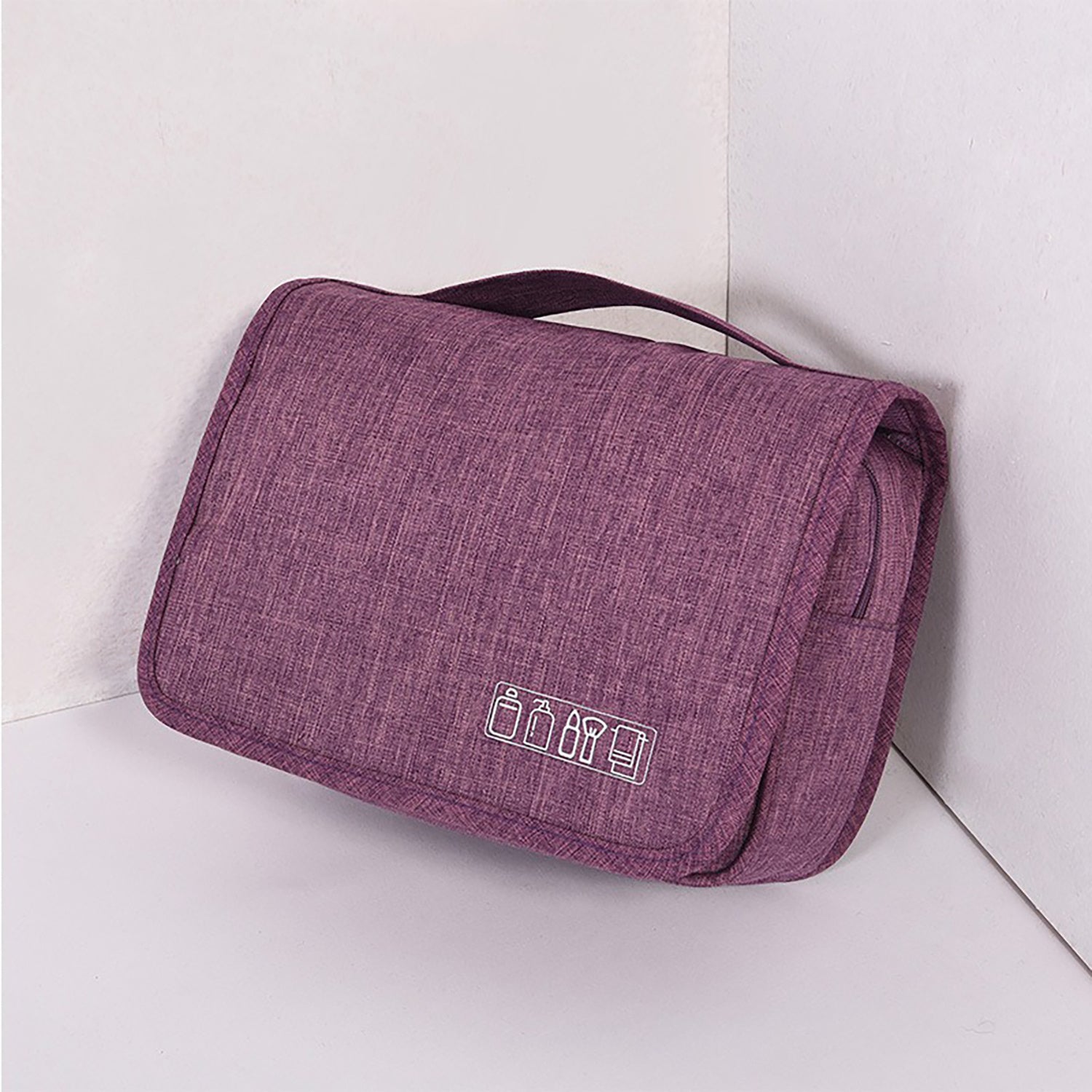 Purple toiletry bag with icons on a white background