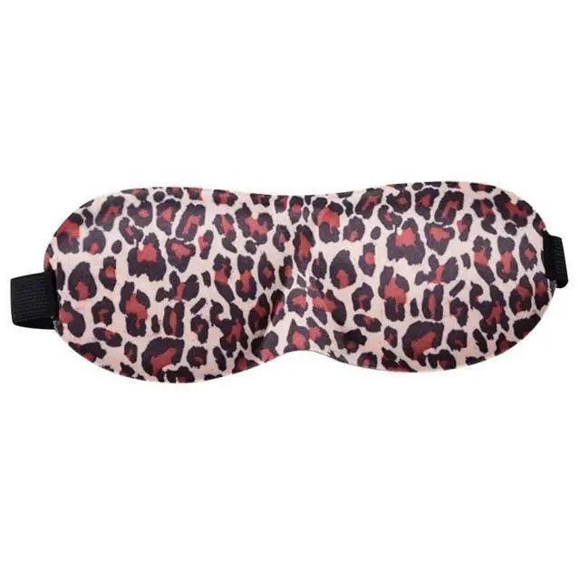 Leopard print sleep mask on a white background