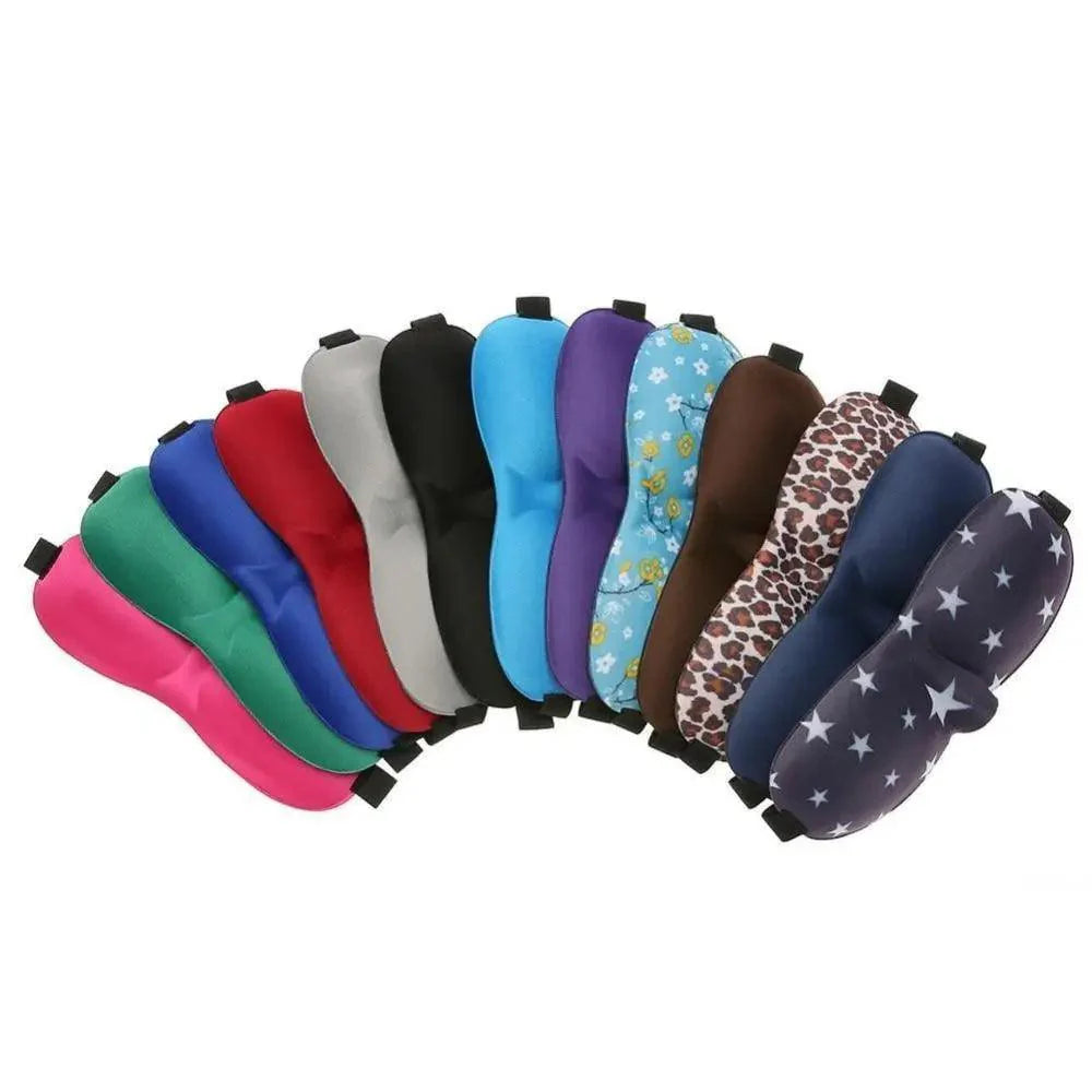 Row of colorful sleep masks with various patterns on a white background