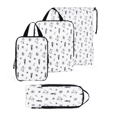 Set of three packing cubes with black patterns on a white background