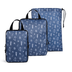 Set of three blue packing cubes with white patterns on a white background