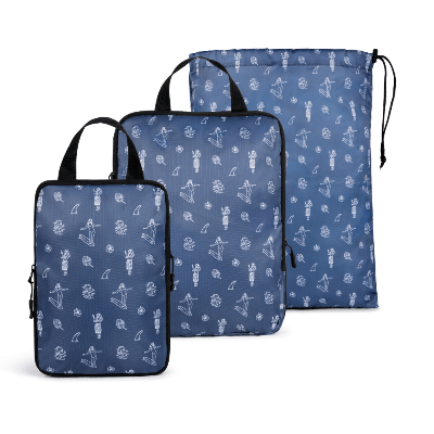 Set of three blue packing cubes with white patterns on a white background