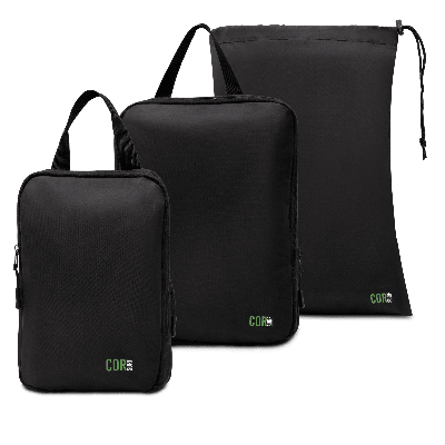 Set of black packing cubes with 'COR' branding on a white background