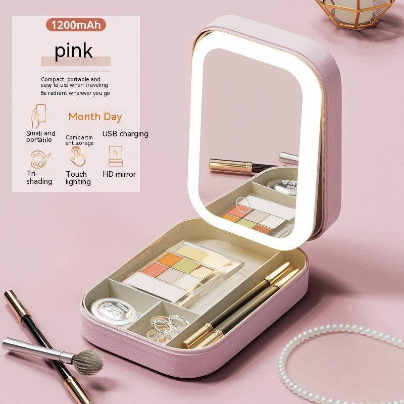 Pink makeup set with mirror and tools on a pink background