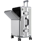 A silver aluminum rolling suitcase with a hinged top lid open to reveal a black interior organizer, shown on a plain white background.