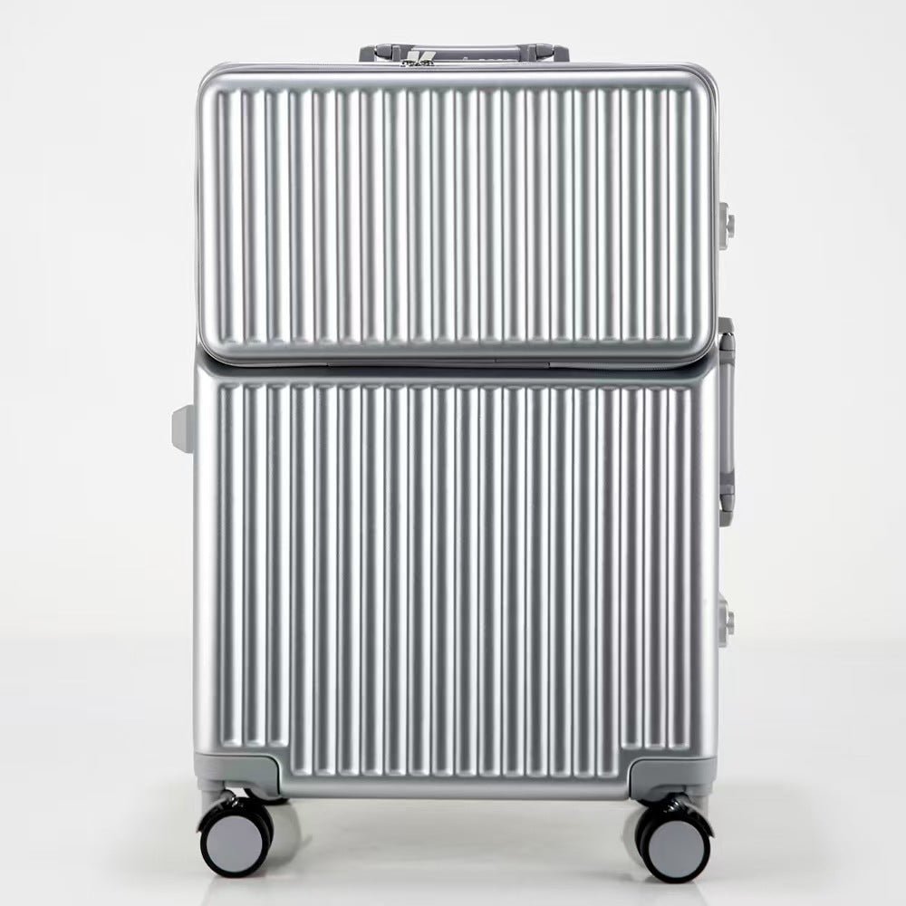 Silver suitcase with a ribbed design on a white background