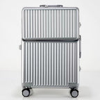 Silver suitcase with a ribbed design on a white background