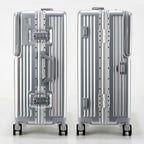 Two silver suitcases with a brand logo on a white background