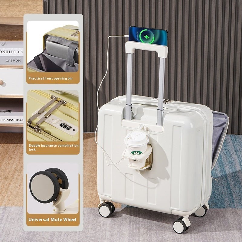 White suitcase with charging cable and packaging on a wooden floor.