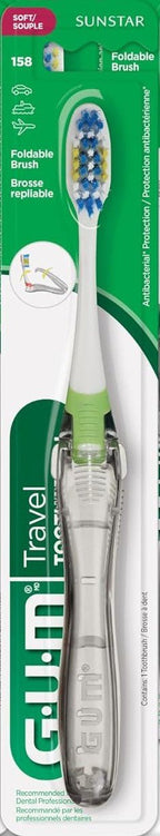 GUM travel folding toothbrush with a green accent in its retail packaging