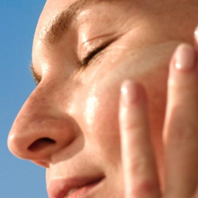 Hawaiian Tropic Silk Hydration Weightless Face Sunscreen SPF 30 application with travel size essentials