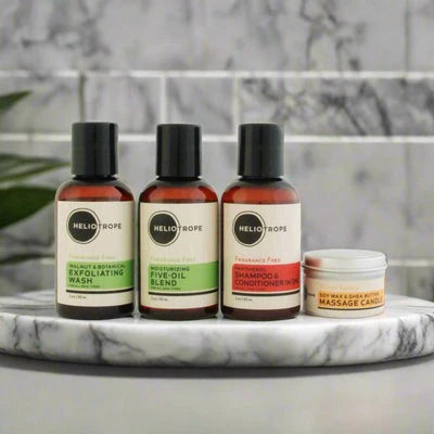 Travel size essentials: organic toiletries kit with wash, oil, and shampoo.