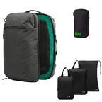 A dark gray Cor2 biodegradable backpack shown open to reveal a bright green interior, alongside its three compressed, flat-folded travel pouches in black with green Cor2 branding. The image is set against a plain white background.